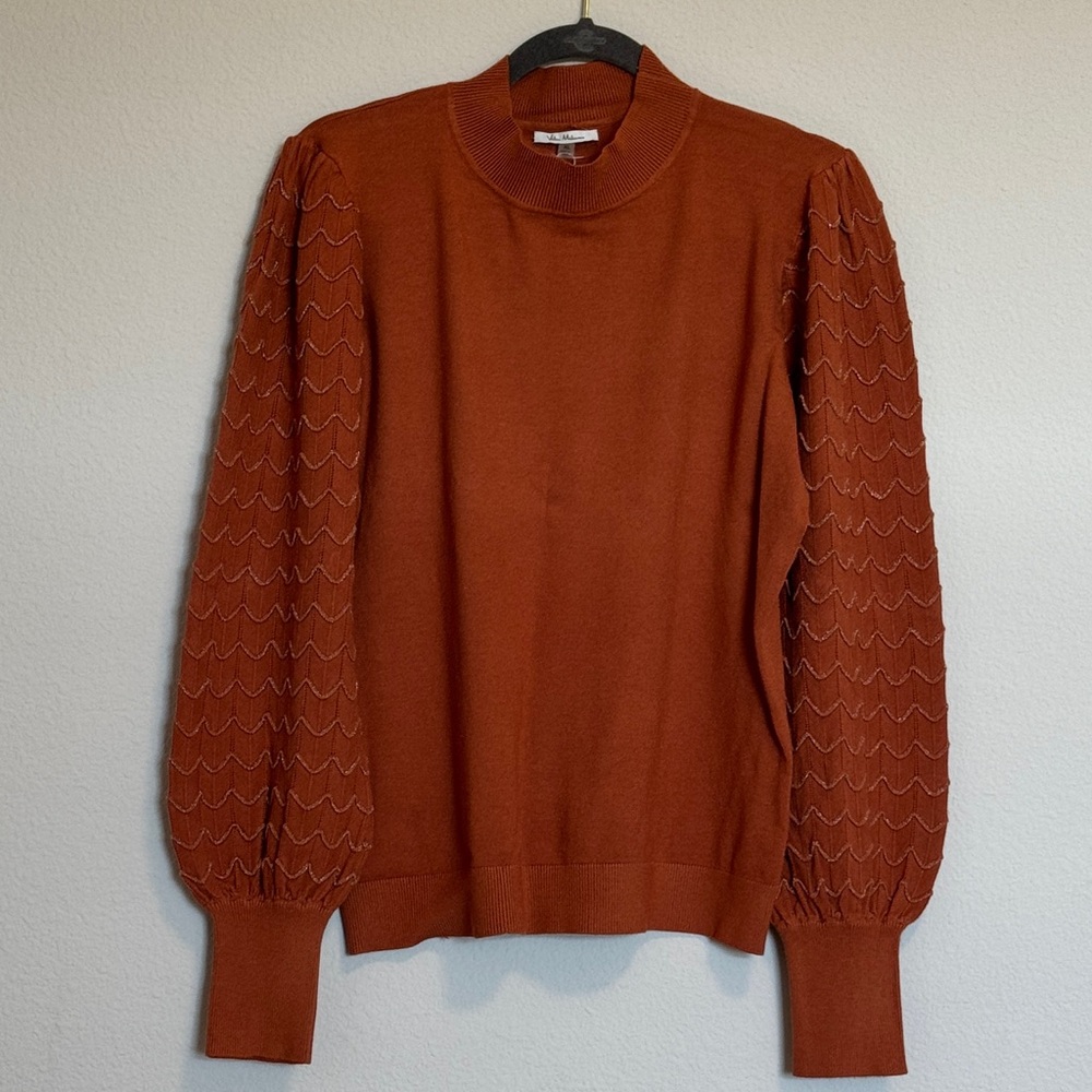 Elegant Rust Turtleneck Sweater with Textured Sleeves